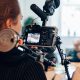 A woman shooting a film with a camera